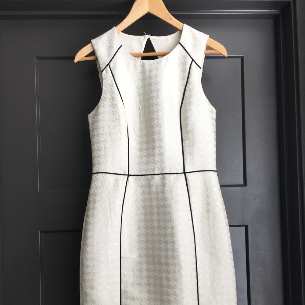 White dress, slight above the knee.